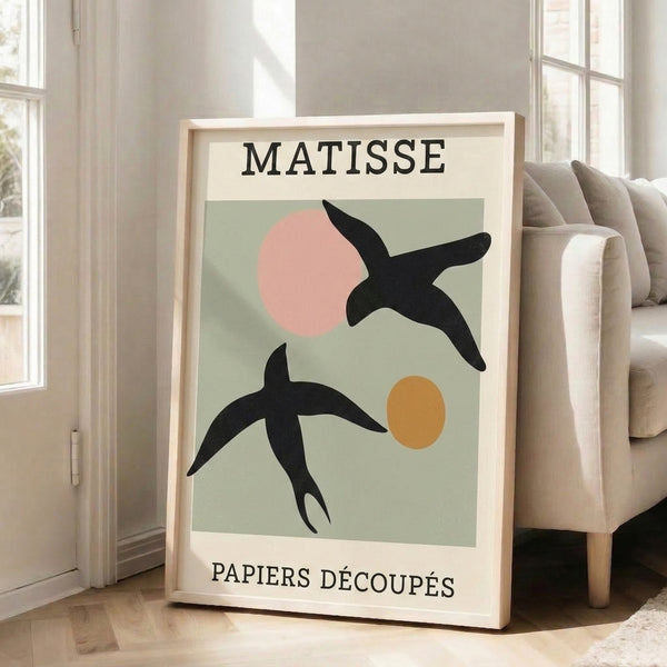 Modernist bird poster with playful geometric and circular shapes in muted palette of sage, ochre, blush pink, and black on cream, framed as minimalist wall décor.