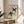 Minimalist framed artwork featuring stylized birds through abstract overlapping shapes in sage green, blush pink, ochre, and cream tones with Bauhaus sensibility.