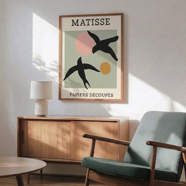 Matisse-inspired poster with abstract avian figures in cut-out shapes, balancing sage green and blush pink against cream background in sophisticated minimalist style.