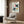 Framed modern bird composition using geometric and circular shapes in soft sage green, ochre, cream, and black—playful yet refined Bauhaus-influenced wall art.