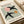 Sophisticated bird artwork featuring Matisse-style papiers découpés shapes in muted sage green, pink, ochre, and black on cream; modernist wall poster.