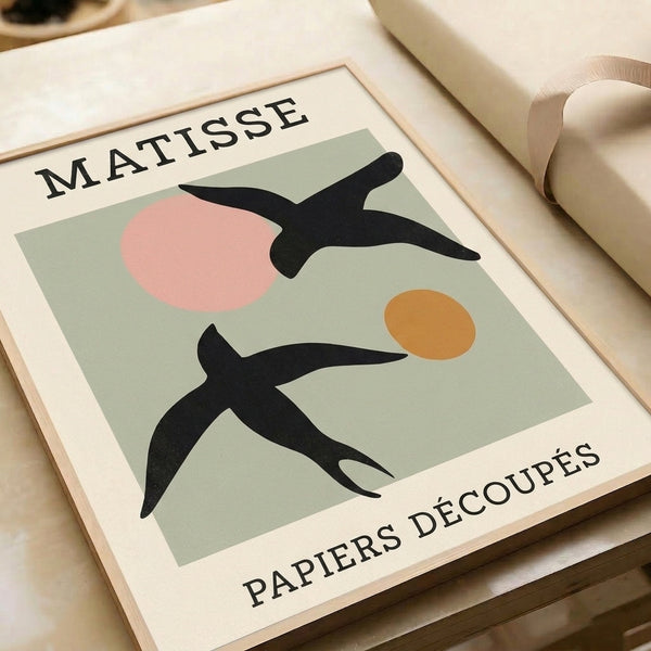 Sophisticated bird artwork featuring Matisse-style papiers découpés shapes in muted sage green, pink, ochre, and black on cream; modernist wall poster.