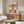 Vibrant pop art composition with whimsical papier découpé cutouts in golden yellow, coral, and blue tones, organized as a joyful grid celebrating organic, leaf-inspired abstract forms.