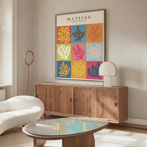 Vibrant pop art composition with whimsical papier découpé cutouts in golden yellow, coral, and blue tones, organized as a joyful grid celebrating organic, leaf-inspired abstract forms.