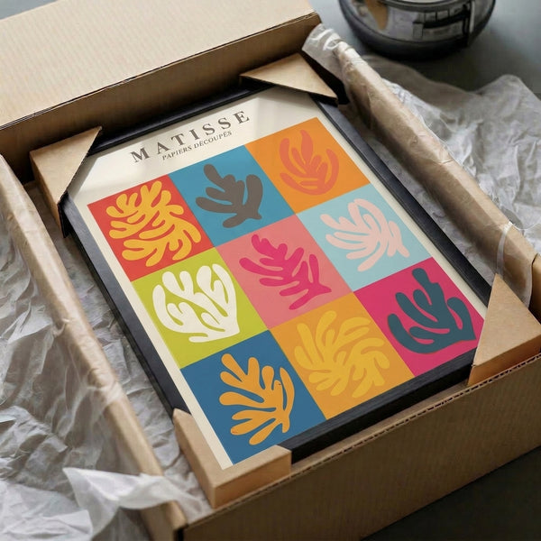 Modern playful poster in jewel tones of chartreuse, dusty rose, sky blue, and coral, showcasing an exuberant arrangement of abstract botanical shapes inspired by Matisse's cut-paper method.