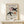 Framed minimalist poster depicting an abstract bird silhouette in cream and terracotta against a soft, contemplative background.