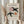Minimalist framed poster of a stylized bird figure with playful circular motifs in cream and terracotta tones.