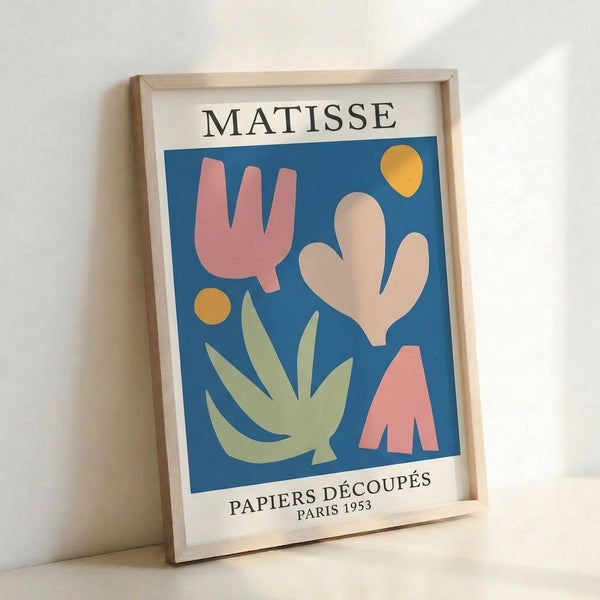 Cheerful abstract composition of overlapping circles and leaf-like shapes in golden yellow, deep blue, and sage green, presented as a framed mid-century print.