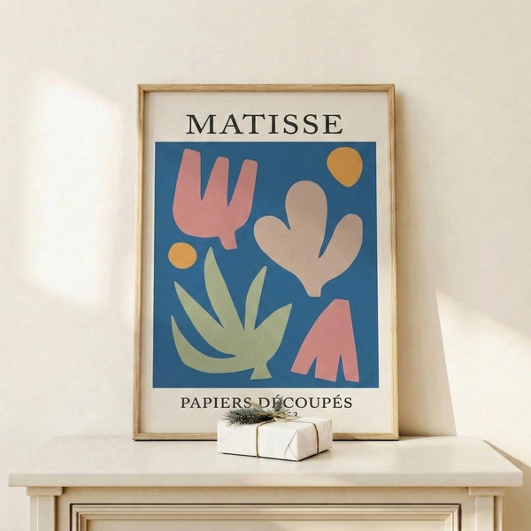 Sophisticated cut-paper style artwork displaying organic cactus and botanical motifs in a palette of terracotta pink, cream, and deep blue.
