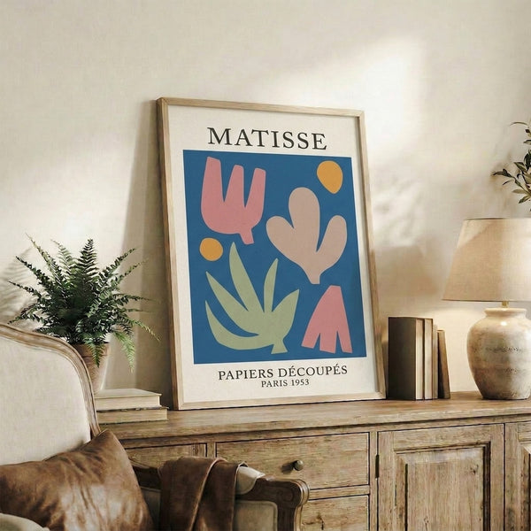 Bold minimalist poster featuring organic forms and circular elements in terracotta, deep blue, and golden yellow, characteristic of mid-century Bauhaus aesthetics.