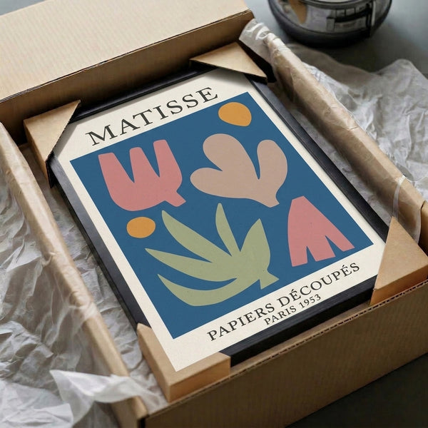 Framed mid-century art featuring playful organic motifs and botanical forms in terracotta pink, cream, and golden yellow with minimalist sensibility.