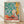 Matisse-inspired still life poster featuring vibrant aubergines, pitcher, and plate arranged on a table with emerald green foliage and soft blue tones, framed on wall.