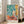 Contemporary still life print featuring layered vegetables and dishware in a harmonious palette of emerald green, soft blue, coral red, and golden yellow.