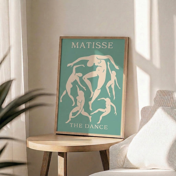 Minimalist framed artwork of dancing forms in soft seafoam green and white, evoking joyful movement and artistic harmony.