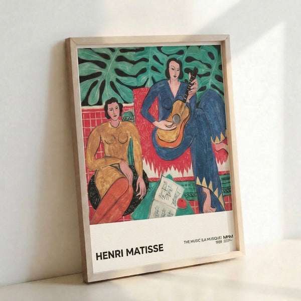 Framed modernist poster showing a woman musician with lush emerald foliage and warm coral-red details in Matisse's The Music composition.