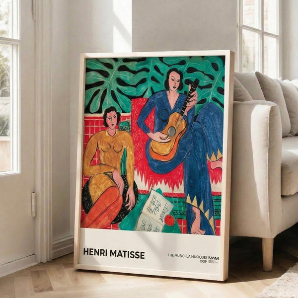 The Music by Matisse wall art featuring a guitarist surrounded by botanical elements in jewel tones of emerald, deep blue, and warm gold.