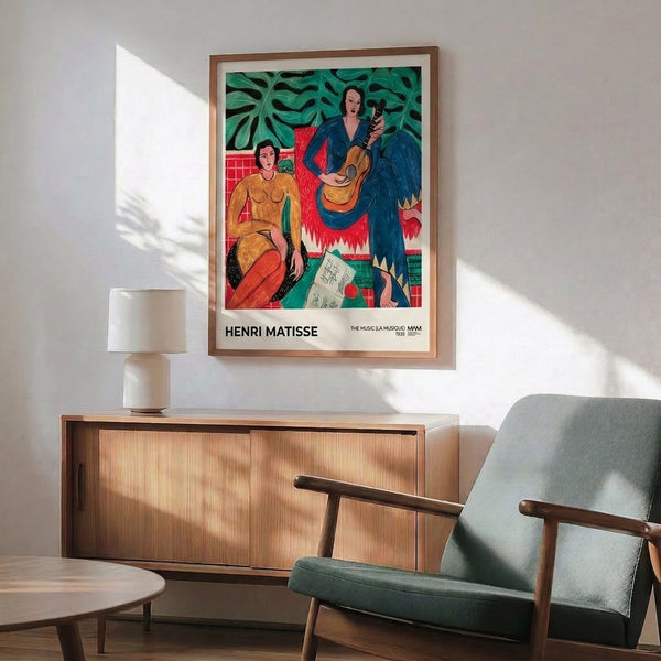 Matisse's The Music print displaying a sensual figure with guitar nestled among vibrant plants in cream, coral, and emerald hues on gallery wall.
