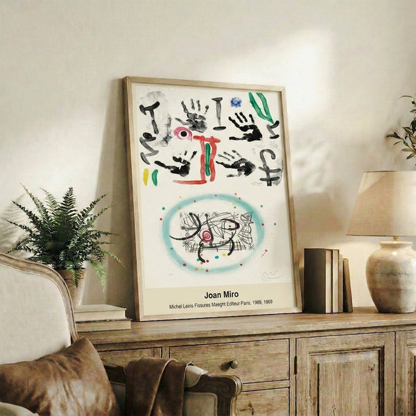 Framed contemporary abstract print with dreamlike biomorphic composition in black, red, blue, and yellow tones suggesting movement and introspection.