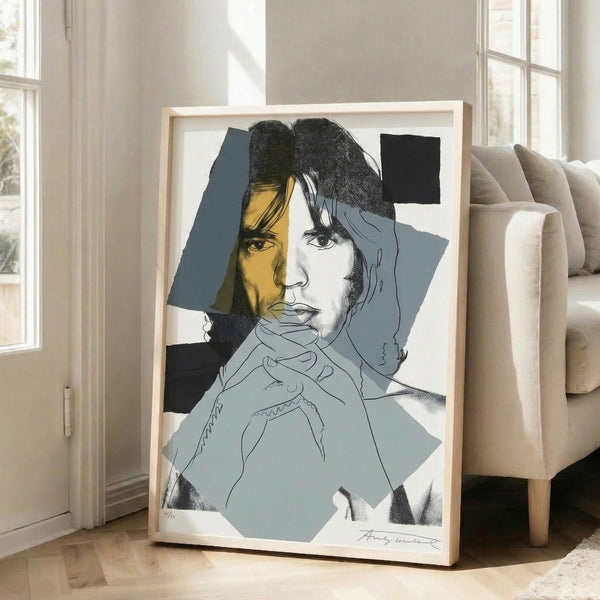 Modern pop art poster of Mick Jagger with high-contrast colors and silkscreen printing technique, displayed as wall art.