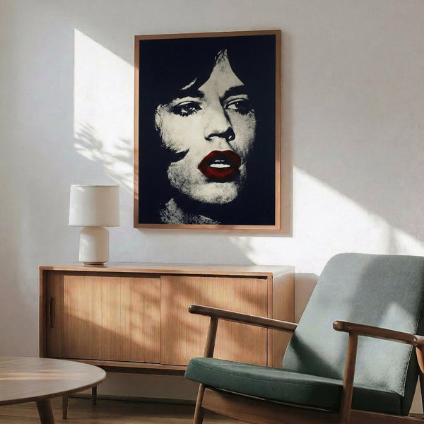 Pop art portrait of Mick Jagger displayed as a framed print, featuring bold colors and graphic illustration style.