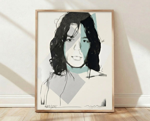 Pop art portrait of Mick Jagger in vibrant colors with bold graphic style, framed on wall as a contemporary art print.