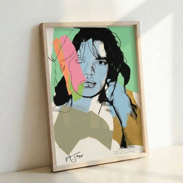 Framed contemporary pop art poster with an expressive portrait rendered in vivid magenta, electric cyan, and yellow highlights on a black and white ground.