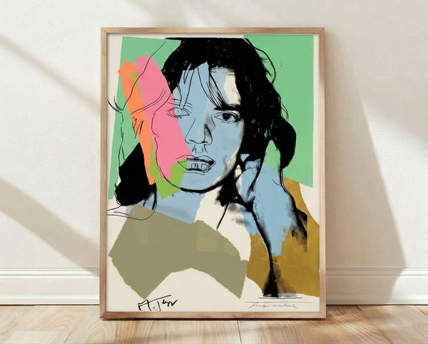 Pop art portrait of Mick Jagger in vibrant contrasting colors, rendered in bold graphic style with layered color separations typical of Warhol's iconic technique.