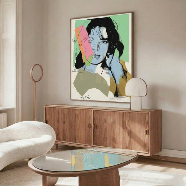 Graphic portrait of Mick Jagger in vibrant pop art style, framed on wall and showcasing bold color juxtaposition and iconic celebrity imagery.