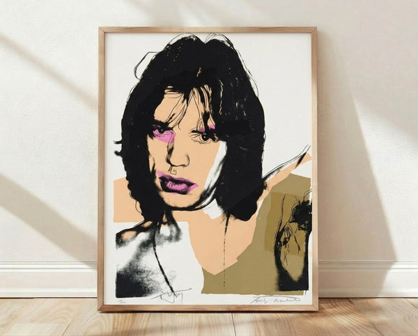 Bold pop art portrait of Mick Jagger in vibrant colors with high-contrast layered printing, characteristic of 1970s Warhol-style celebrity artwork displayed as a framed poster.