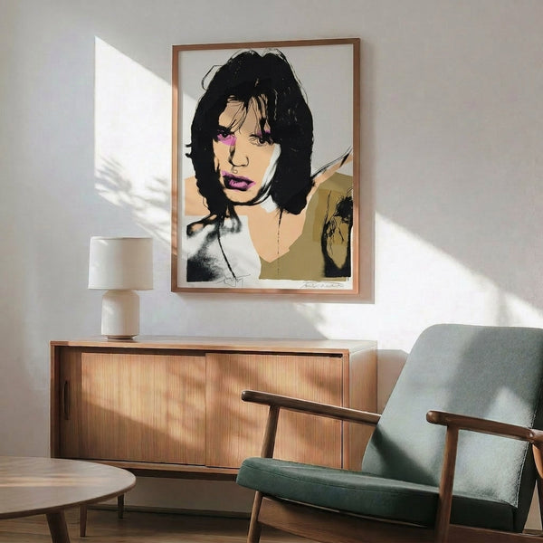 Eye-catching pop art print with layered color blocks and bold outlines depicting a rock music legend, framed and hung on a wall.