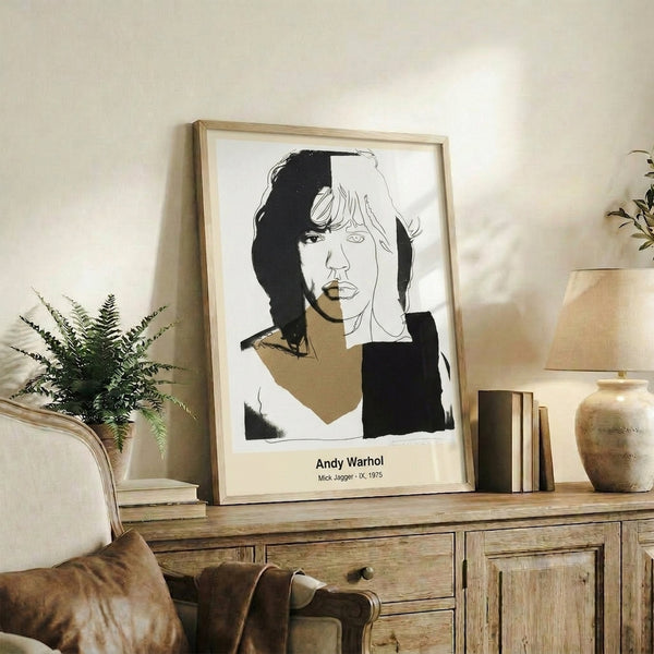Iconic pop art print of a musician's face rendered in vibrant neon hues and black outlines, showcasing Warhol's distinctive modern abstract style.