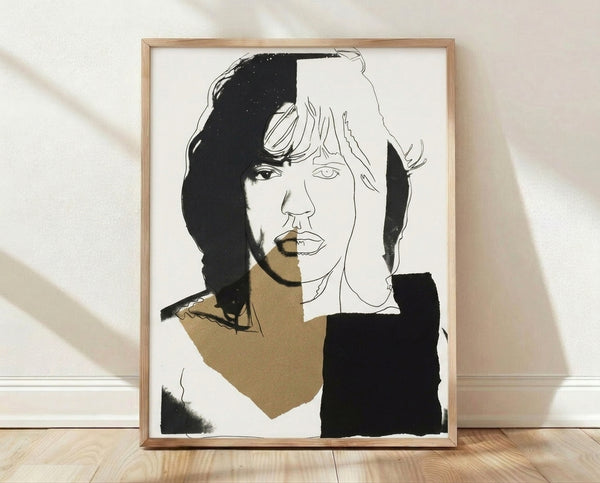 Pop art portrait of Mick Jagger in vibrant colors featuring bold contrasting hues and high-contrast printing, framed poster on wall.