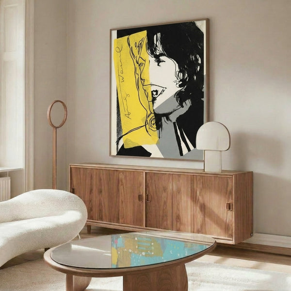 Abstract portrait print of Mick Jagger featuring bold color palette and graphic pop art style in wall frame.