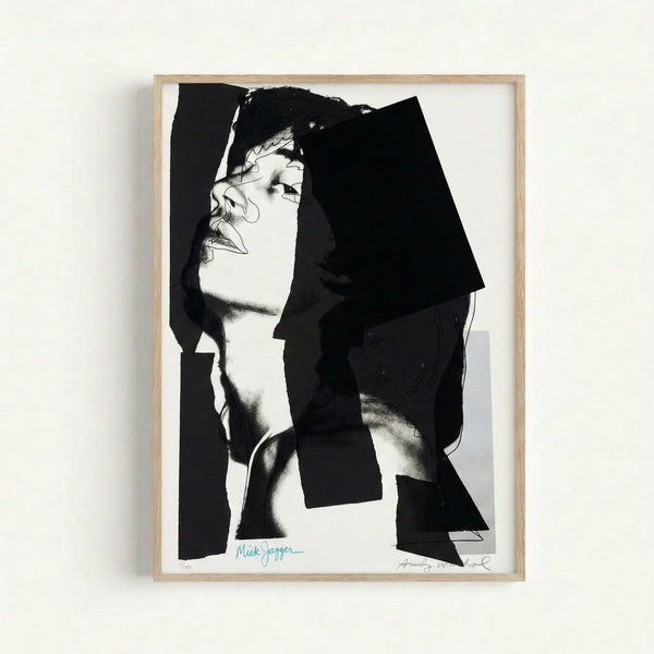 Framed Warhol-style pop art print featuring Mick Jagger with striking color blocking and high-contrast silkscreen aesthetic.