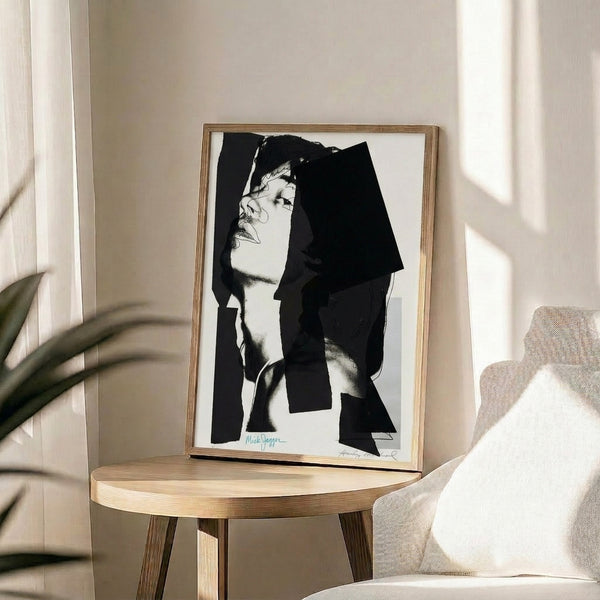 Framed art print of Mick Jagger in pop art style with dramatic color separation and the minimalist graphic sensibility of the era.
