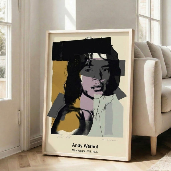 Warhol-inspired portrait print of Mick Jagger using bold black lines with vibrant pink, yellow, and blue color blocking in a modern pop art style.