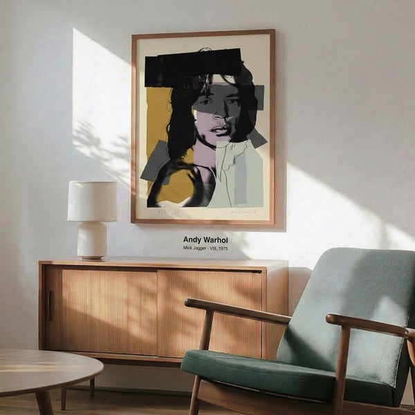 Edgy pop art framed print of the Rolling Stones frontman rendered in striking neon hues—pink, yellow, and blue—with dramatic black shadows and contours.