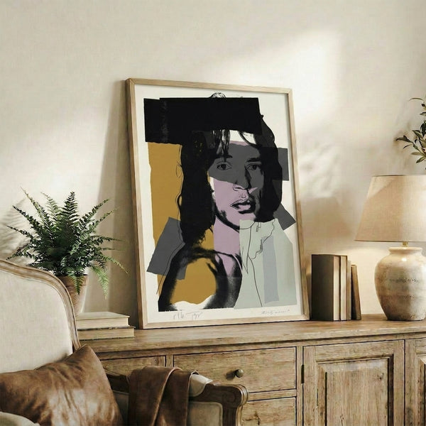 Vibrant pop art wall print of Mick Jagger with electric color separations in purples, oranges, and teals, executed in Warhol's iconic silkscreen style.