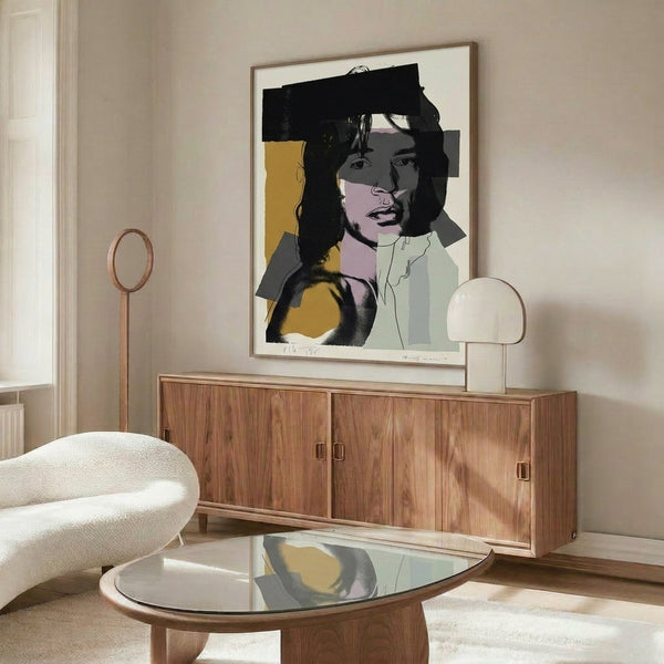 Mick Jagger portrait in striking neon and jewel-tone color blocking, displayed as framed pop art inspired by Andy Warhol's famous technique.