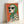 Cool, funky dalmatian portrait wearing emerald headscarf and sunglasses rendered in mid-century modern aesthetic with cream, orange, and slate blue palette.