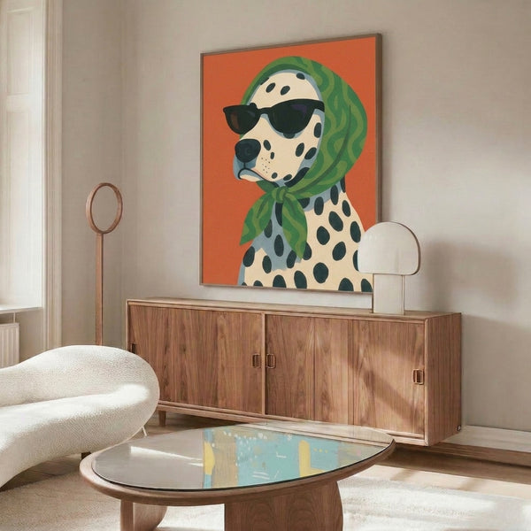 Playful retro poster of cool dalmatian sporting sunglasses and emerald scarf, framed mid-century illustration in orange, cream, slate blue and black hues.