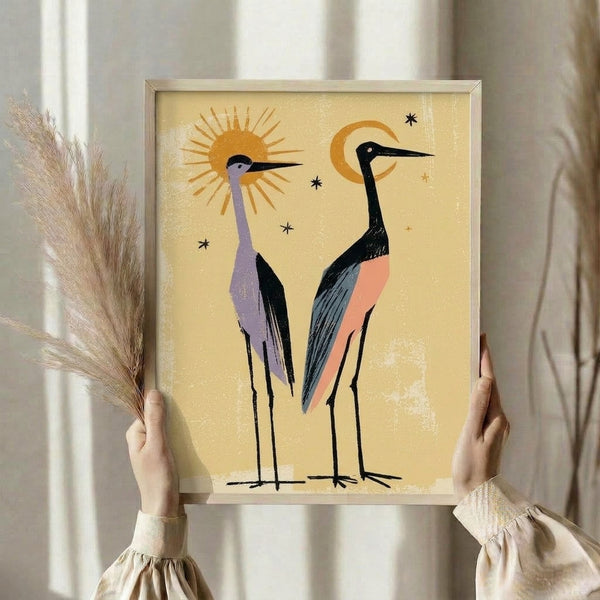 Celestial bird poster showcasing two graceful cranes amid sun, moon, and star elements in warm gold and coral with cool lavender accents, mid-century modern aesthetic.