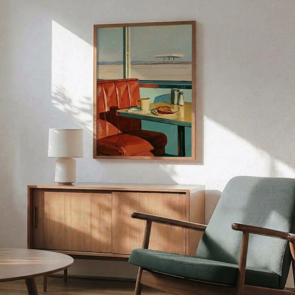 Mid-century modern art print featuring a cozy diner booth interior in red, cream, and sage green, gazing out at a tranquil sandy desert landscape under clear skies.