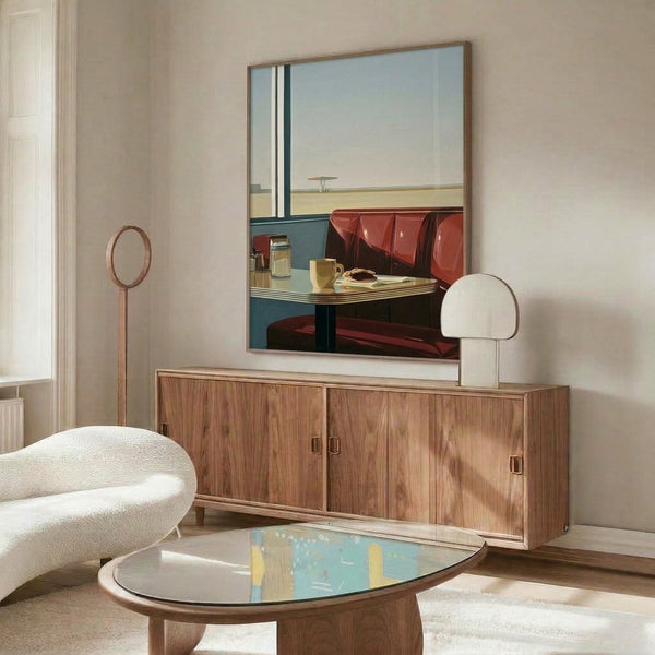 Contemplative mid-century modern print of a diner booth interior with coffee service and expansive window view of a desert road and horizon at sunset, featuring warm cream, teal, and tan tones.