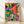 Retro mid-century modern poster featuring a saxophonist in vibrant orange, teal, and purple tones with a playful jazz club aesthetic, accented by potted plants and a cocktail glass on a table.