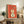 Minimalist musical instrument poster showing a stylized coral violin in mid-century aesthetic, matted and framed with teal, gold, and cream tones.