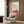 Minimalist skateboard-themed poster in cream, yellow, and red geometric shapes with Bauhaus-style composition, creating a bold and modern visual statement.