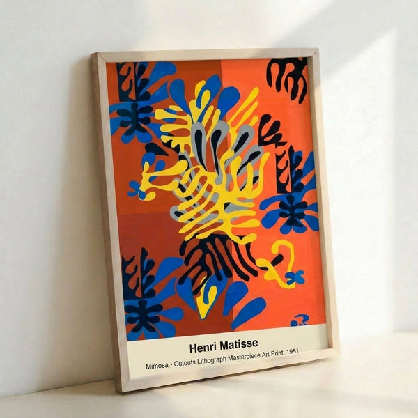 Abstract wall art poster showcasing Matisse's distinctive cutout technique applied to flowering mimosa leaves and blooms in vibrant warm tones and cool blue accents against a dark background.