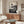 Abstract minimalist poster showcasing meditative stone spiral design with flowing linear details in charcoal and gold on warm cream, serene japandi style.