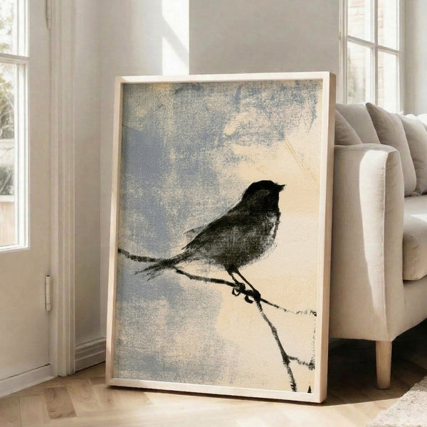 Framed poster featuring a serene sparrow sitting on a thin branch, executed in elegant black line work against a cream base with subtle cool tones, evoking calm and contemplation.